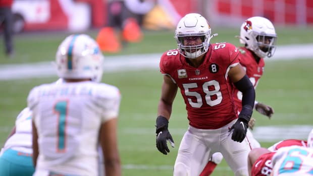 Arizona Cardinals middle linebacker Jordan Hicks (58) looks Miami Dolphins quarterback Tua Tagovailoa (1) during the first half at State Farm Stadium.